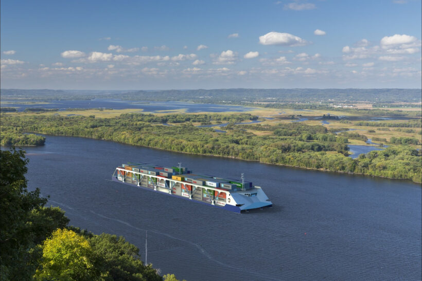 Photo from: https://www.americanpatriotholdings.com/ is a rendering of shipping containers on a container barge on the Mississippi River with surrounding landscape of trees, water, and blue sky dotted with small puffy white clouds.