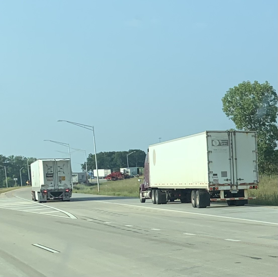 Image of 2 trucks on road